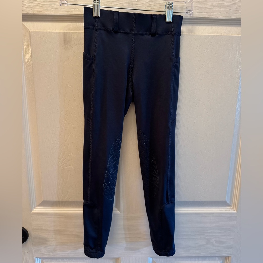 Ovation girls size 10 Navy riding tights. Silicone knee patches. Belt loops.